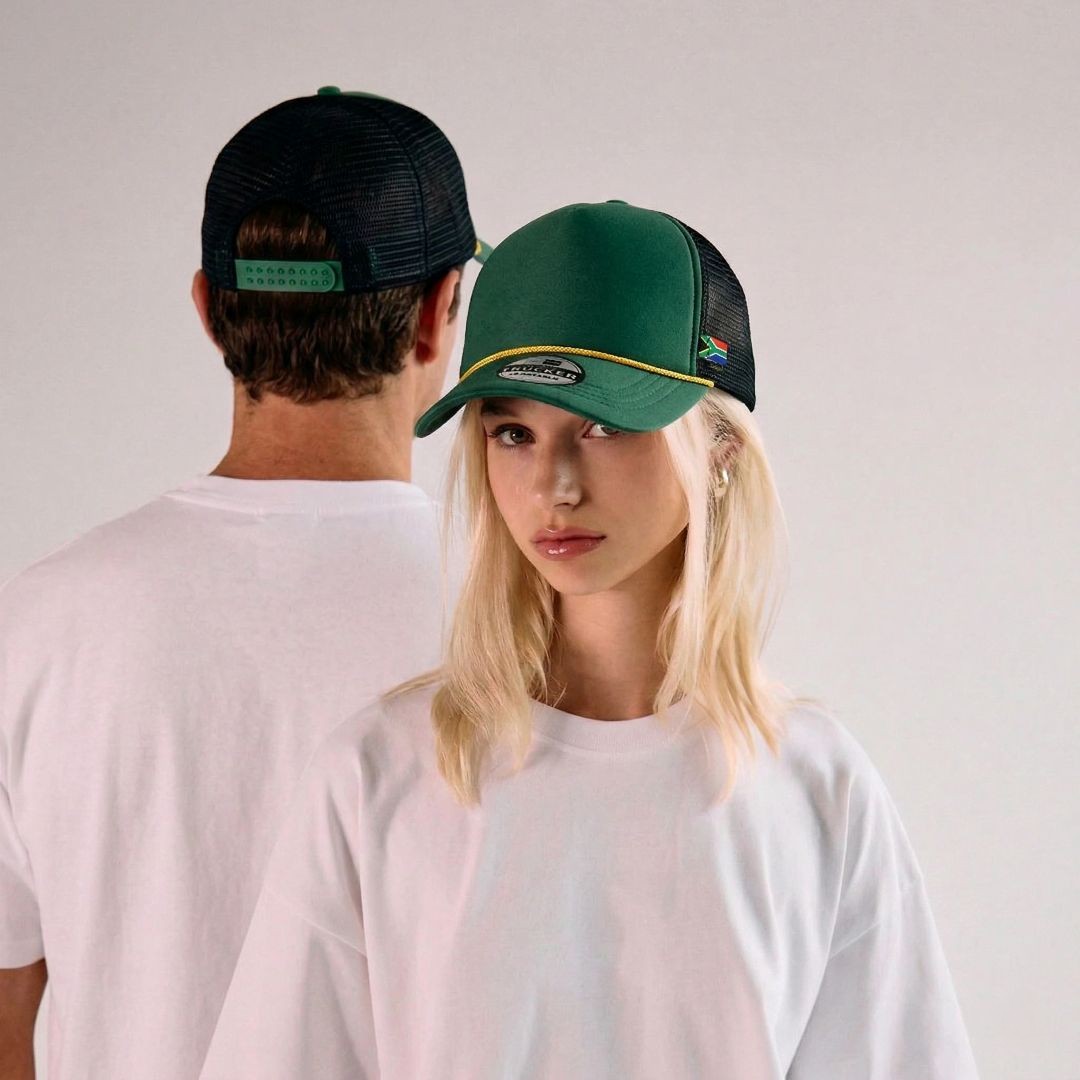 Model wearing a trucker cap